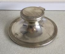A good circular silver capstan shaped ink well. Es