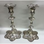 A good pair of cast silver candlesticks of typical