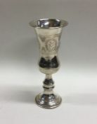 A large tapering silver Kiddush cup with engraved