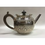 A circular bachelor's silver teapot decorated with