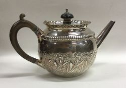 A circular bachelor's silver teapot decorated with