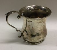 A plain silver baluster shaped Edwardian mug. Lond