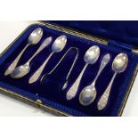 A boxed set of six silver bright cut teaspoons. Sh