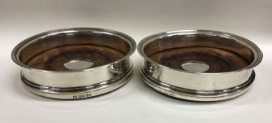 A good pair of Georgian silver wine coasters with