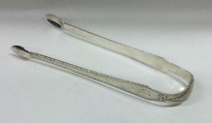 A good pair of bright cut silver sugar tongs. Lond