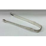 A good pair of bright cut silver sugar tongs. Lond