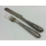 A finely cast Chinese silver knife together with m