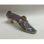 A novelty silver pincushion in the form of a shoe
