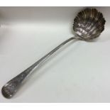 A heavy Georgian silver soup ladle with bright cut