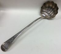 A heavy Georgian silver soup ladle with bright cut