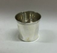 A small tapering silver spirit to with reeded rim.