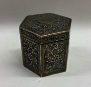 A good chased silver tea caddy of shaped form with