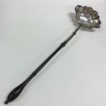 A good Georgian silver toddy ladle with turned han