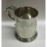 A large Georgian silver tapering mug of Britannia