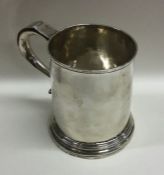 A large Georgian silver tapering mug of Britannia