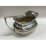 An Edwardian silver half fluted cream jug with gad