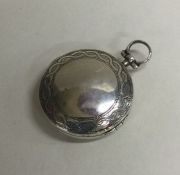An unusual circular silver gilt vinaigrette with h