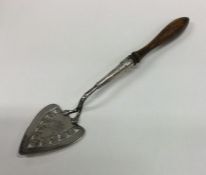 A rare silver pastry trowel with pierced decoratio