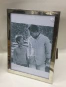 A large plain Sterling silver picture frame with m