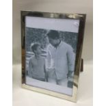 A large plain Sterling silver picture frame with m