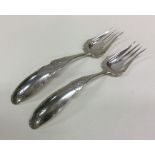 A large pair of Dutch silver engraved forks with p