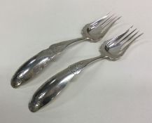 A large pair of Dutch silver engraved forks with p