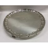 A heavy large Edwardian silver salver of shaped fo
