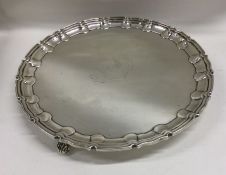 A heavy large Edwardian silver salver of shaped fo