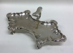 A large Georgian silver snuffer tray with shell de