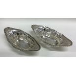 A pair of Edwardian shaped silver pierced dishes.