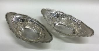 A pair of Edwardian shaped silver pierced dishes.