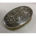 An unusual Chinese silver hairbrush decorated with