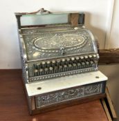 An old American style cash register. Est. £100 - £