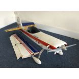 A large scratch built model Extra 300 aircraft wit