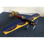 A scratch built model Extra 200 aircraft with blue