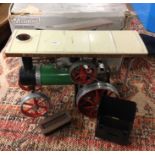 A Mamod Traction Engine model with box and original burner. Est. £60 - £70.