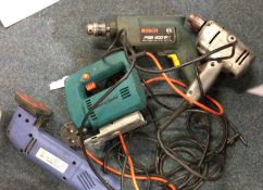 A Collection of Power Tools to include two electric drills, a planer and a Black & Decker jigsaw