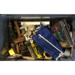 A box containing assorted tools comprising various hammers and a drill