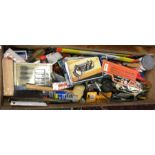 A tray containing assorted woodworking tools comprising planes,