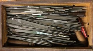 A wooden box containing assorted files of varying sizes. Est. £10 - £20.