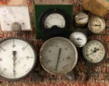 A wooden box containing assorted gauges to include a rare