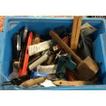 A box containing assorted tools comprising a small vice,