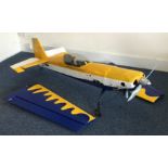 A large scratch built model Extra 300 aircraft wit