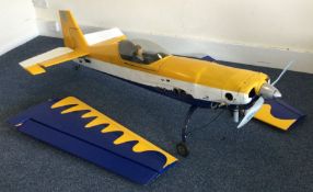 A large scratch built model Extra 300 aircraft wit