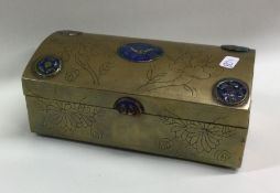 A Chinese brass and enamel decorated dome top box