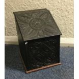 An old carved top box. Est. £20 - £30.