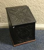 An old carved top box. Est. £20 - £30.