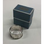 An engine turned silver napkin ring. Birmingham. A