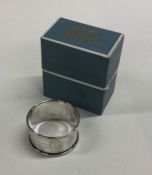 An engine turned silver napkin ring. Birmingham. A