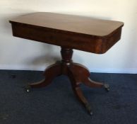 A mahogany single drawer occasional table on four
